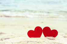 Two Red Hearts On The Summer Beach. Love, Wedding And Valentines Day Concept.