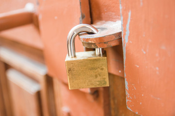 Close-up padlock on the door for wooden door lock at home 