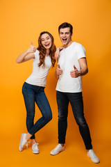 Canvas Print - Full length portrait of a cheerful young couple