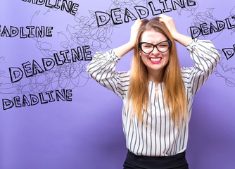 Wall Mural - Deadline with young business woman feeling stressed