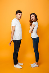 Wall Mural - Full length image of Displeased Young couple looking at camera