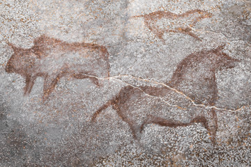 Wall Mural - images of ancient animals on the wall of the cave, made by an ancient human ocher. stone Age. archeology. history of antiquities.