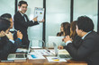 © 88studio - businessman present financial plan report to co worker team. man leader discuss sales data with investor colleagues. finance investment business meeting