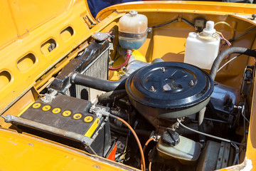 Under the hood of a retro russian car, car engine of old soviet vehicle Moskvich-412