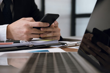 businessman holding smartphone & using app. man texting message at office. social network communicat