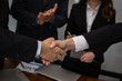 © 88studio - Business people shaking hands after finishing up meeting. co worker colleagues handshaking after conference. teamwork, partnership, collaboration, corporate concept.