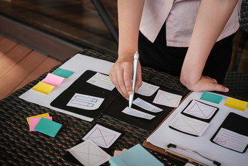 user experience, ux designer designing web on smartphone layout. ui planning mobile application. dev