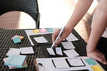 user experience, ux designer designing web on smartphone layout. ui planning mobile application. dev