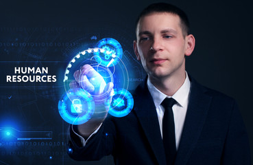 Business, Technology, Internet and network concept. Young businessman working on a virtual screen of the future and sees the inscription: Human resources