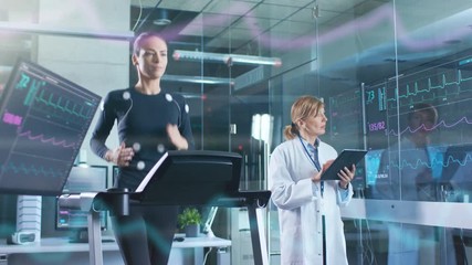 Wall Mural - woman athlete runs on a treadmill with electrodes attached to her body while scientist holding table