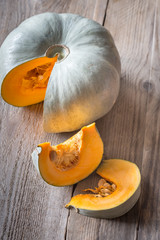 Wall Mural - Ripe pumpkin on the wooden background