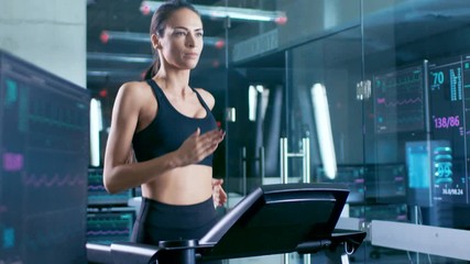 Wall Mural - in scientific sports laboratory beautiful woman athlete runs on a treadmill with electrodes attached