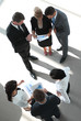 © ASDF - view from the top. business team with financial schedules,standing in the lobby of the office