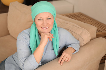 Wall Mural - Mature woman with cancer in headscarf indoors