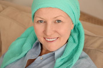 Wall Mural - Mature woman with cancer in headscarf indoors