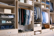 Big Wardrobe With Male Clothes For Dressing Room