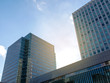 © Nischaporn - Common modern business , high-rise buildings, architecture raising to the blue sky with sunlight . Concepts of financial, business