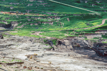 Part of a pit with big mining truck working