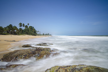 Wall Mural - idyllic tropical island scenery with crystal clear turquoise water and blue sky background