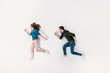 © LIGHTFIELD STUDIOS - top view of couple pretending to run isolated on white