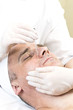 © lester120 - Man in the mask cosmetic procedure in spa salon.
