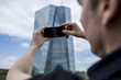 © Nektarstock - Man Photographing Skyscraper in Frankfurt