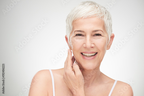 Fotografía Portrait of beautiful senior woman in front of white background.