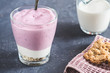 Blueberry yogurt natural oat flakes granola several layers in a glass