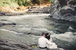 wedding on the shore of a waterfall in the carpathians