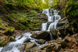 Waterfall Shypit, cascade in Pylypets in the autumn forest. Carpathian Mountains, Zakarpatska oblast, Ukraine.