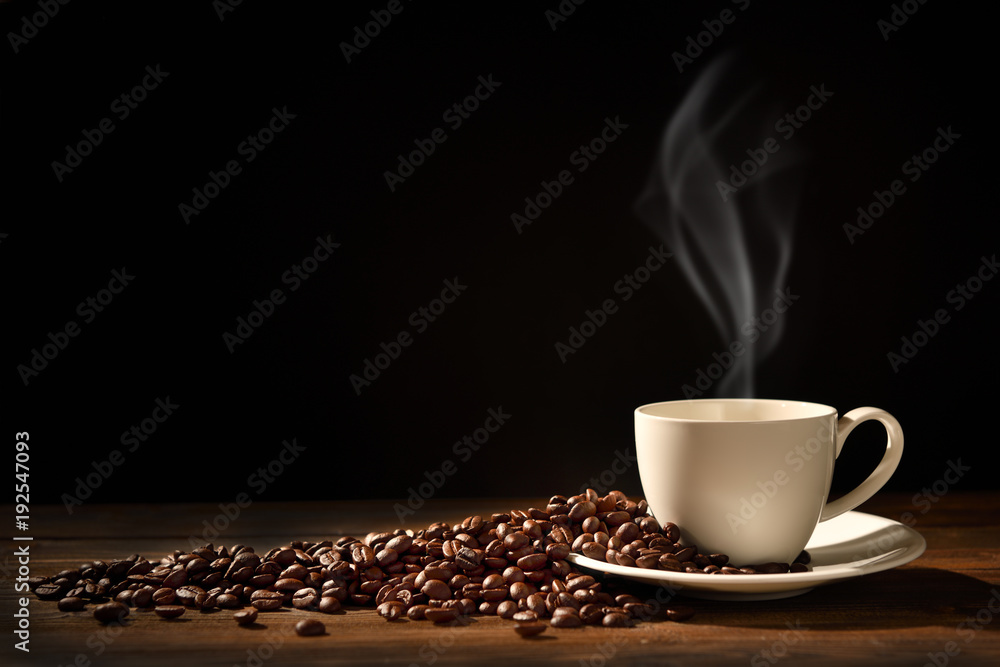Obraz na płótnie Cup of coffee with smoke and coffee beans on black background, This image with no smoke is available w salonie