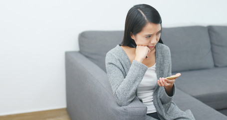 Sticker - Young Woman writing on memo at home