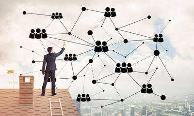 businessman on house roof presenting networking and connection c