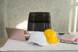 © xreflex - Desks of engineers with laptops,safety helmet, digital tablet