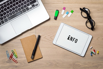 Wall Mural - Info written on tablet lying on desk as flatlay