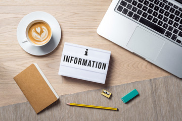 Wall Mural - Information writing in lightbox lying on desk as flatlay