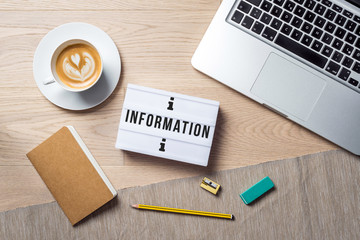 Wall Mural - Information writing in lightbox lying on desk as flatlay