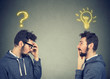 Two men thinking one has a question another solution with light bulb above head