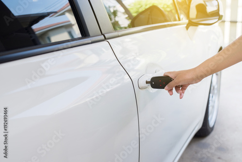 Close Up Of Hand Female Driver Holding Car Keys Using Open Door