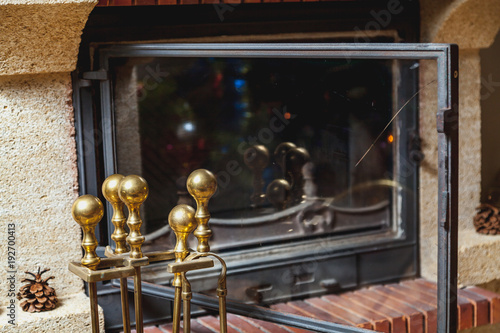Set Of Brass Tools Stands In Front Of Fireplace Buy This Stock