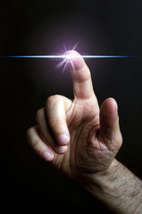 Wall Mural - hand touching star light as concept of mystical, divine, spiritual universe and light soul