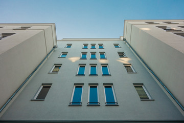 symetric facade of apartment complex in cold colors