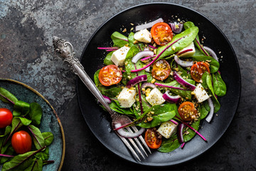 Canvas Print - plate of nutritious simple salad with chard, walnuts, soft cheese, onions and oil