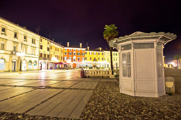 Central square colorful architecture in Italian town of Palmanova evening view