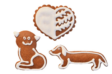 Wall Mural - Cat loves dog - gingerbread in a shape of heart, cat and dog isolated on a white background