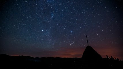 Wall Mural - moving stars above hills. overnight in wild areas.