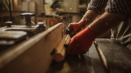 Wall Mural - carpenter works with manual and electric equipment