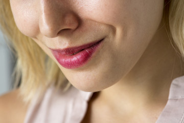 Wall Mural - Closeup of smiling woman's smile