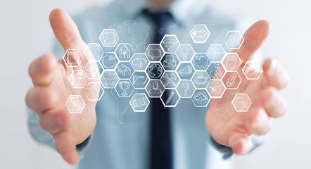 Businessman holding multimedia hand-drawn interface
