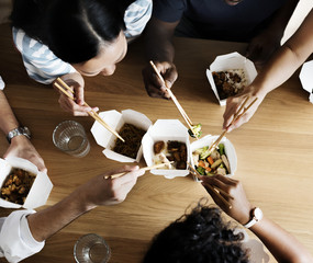 Friends eating Chow mein together